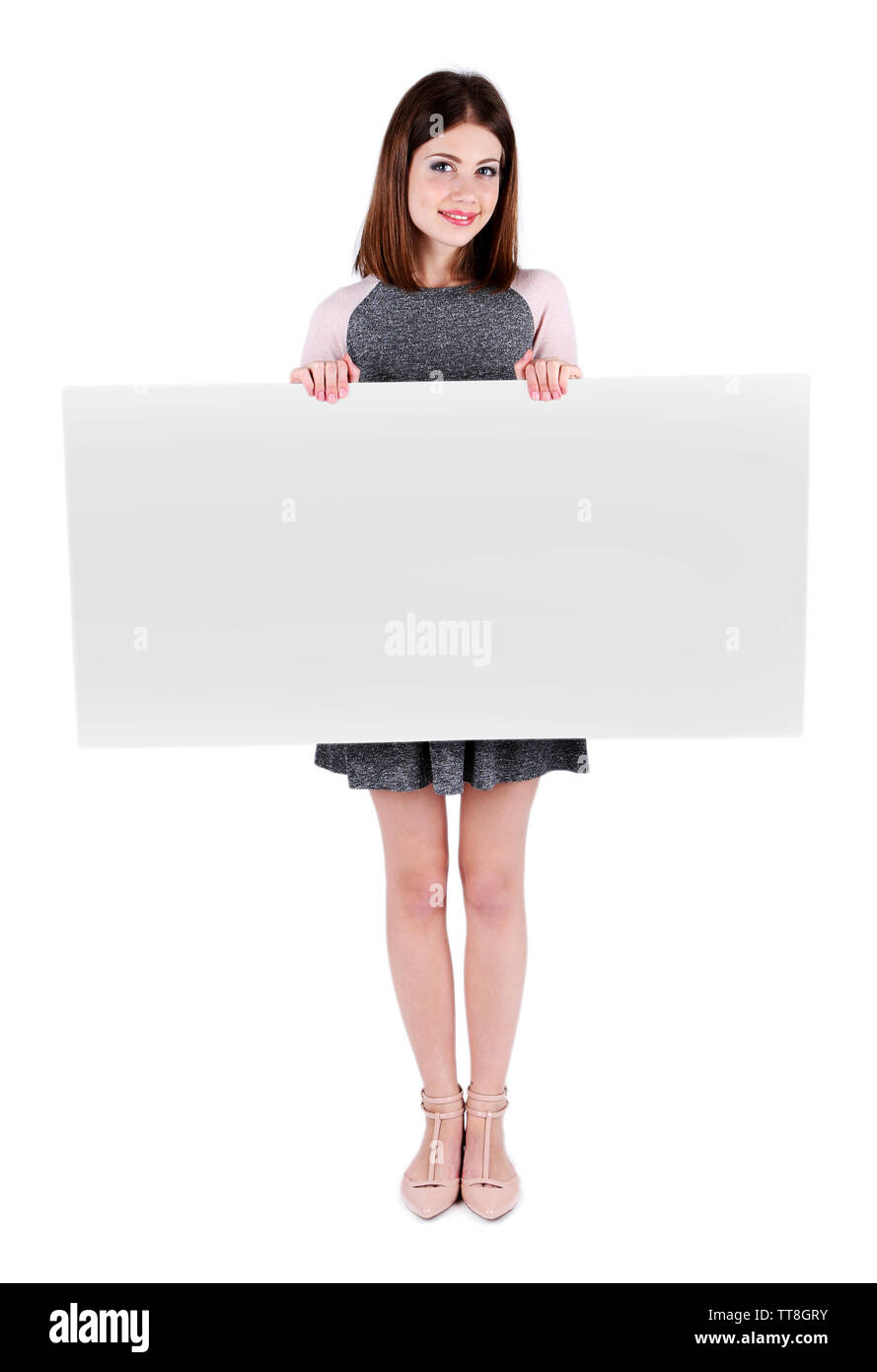 Beautiful young woman holding blank poster isolated on white Stock ...