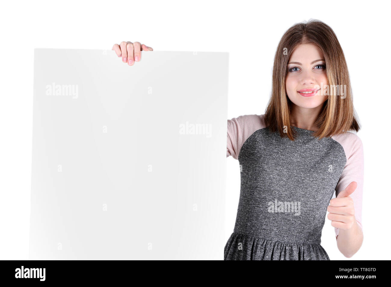 Beautiful young woman holding blank poster isolated on white Stock ...