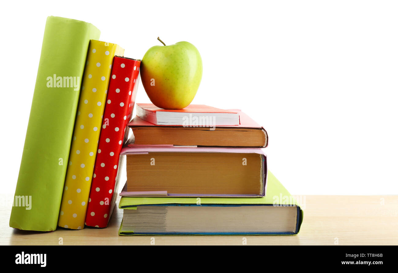 Books and apple on desk, isolated on white Stock Photo - Alamy