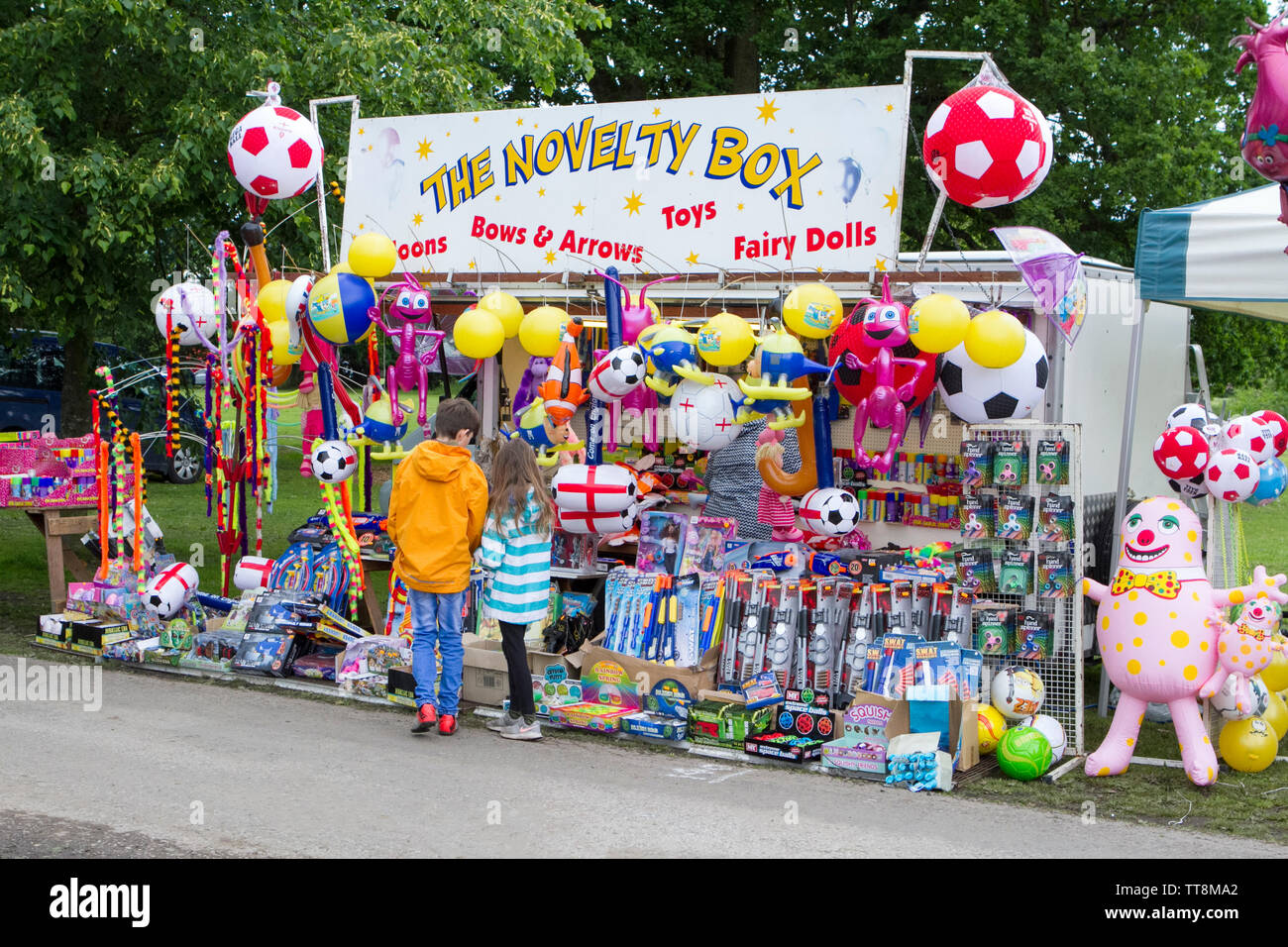 A novelty toy stall store at the Leyland Park Festival in Leyland, Lancashire, UK Stock Photo