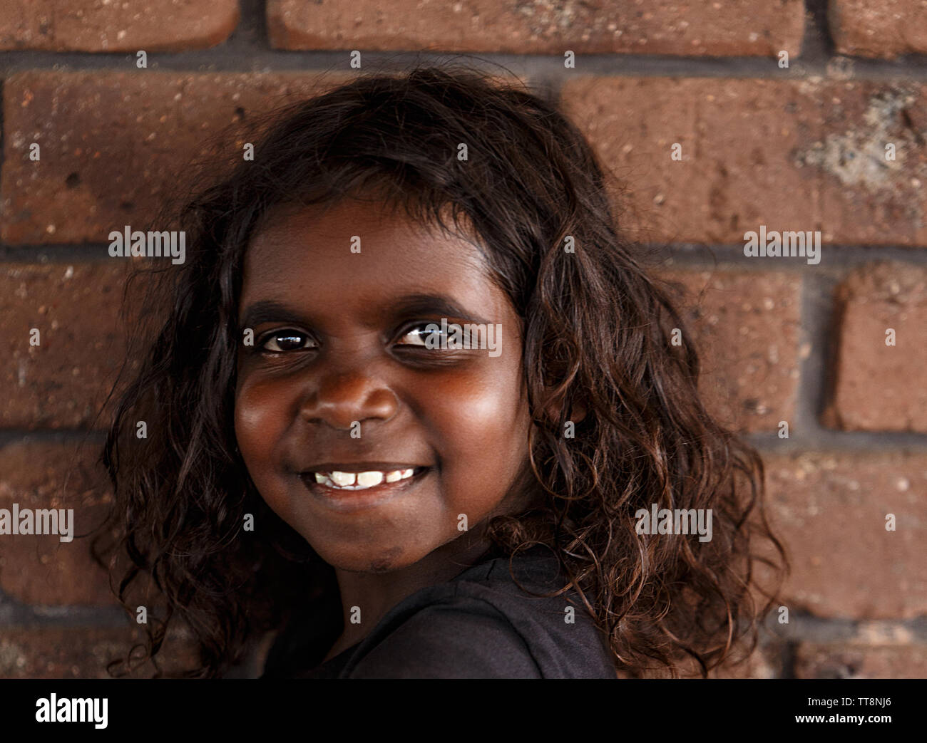 Darwin, Australia-October 05,2018: Australian aborigine girl enjoys a family meal at a local restaurant , Darwin-Australia Stock Photo