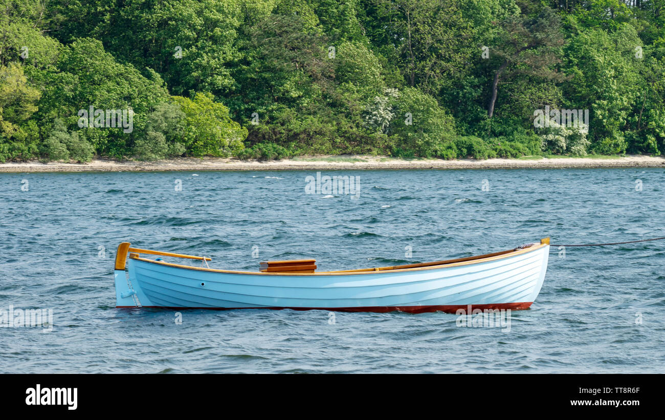 Fishing boat tethered to post in baltic sea horizontal panorama Stock Photo
