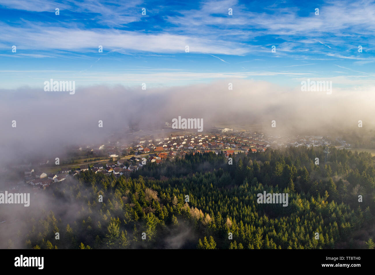Aerial view out of the clouds Stock Photo