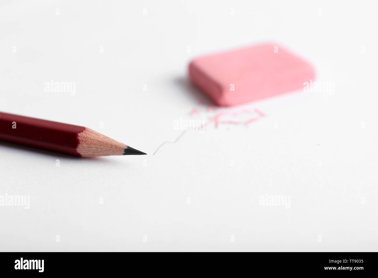 Eraser and pencil on paper background Stock Photo