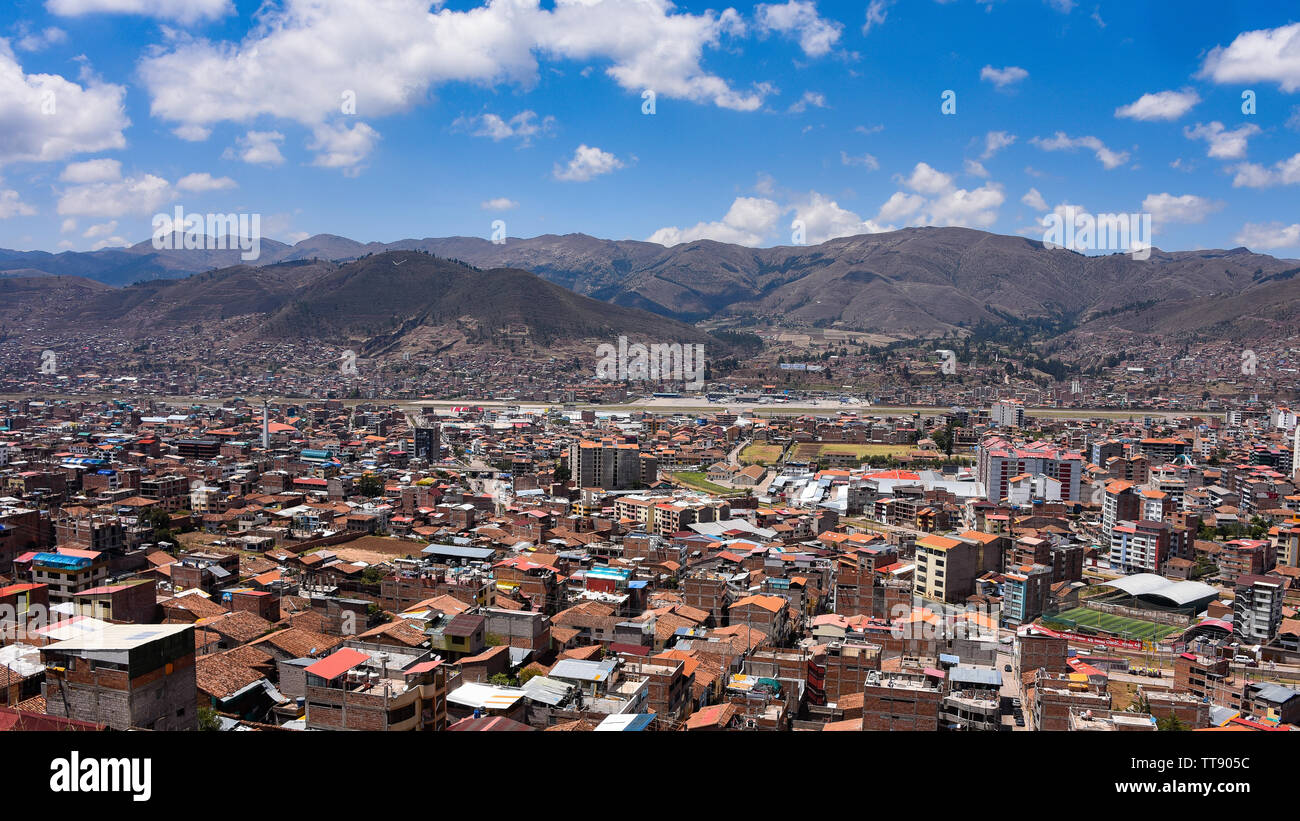 Views of Cusco airport and the San Sebastien district from Rumiwasi. Cusco, Peru Stock Photo