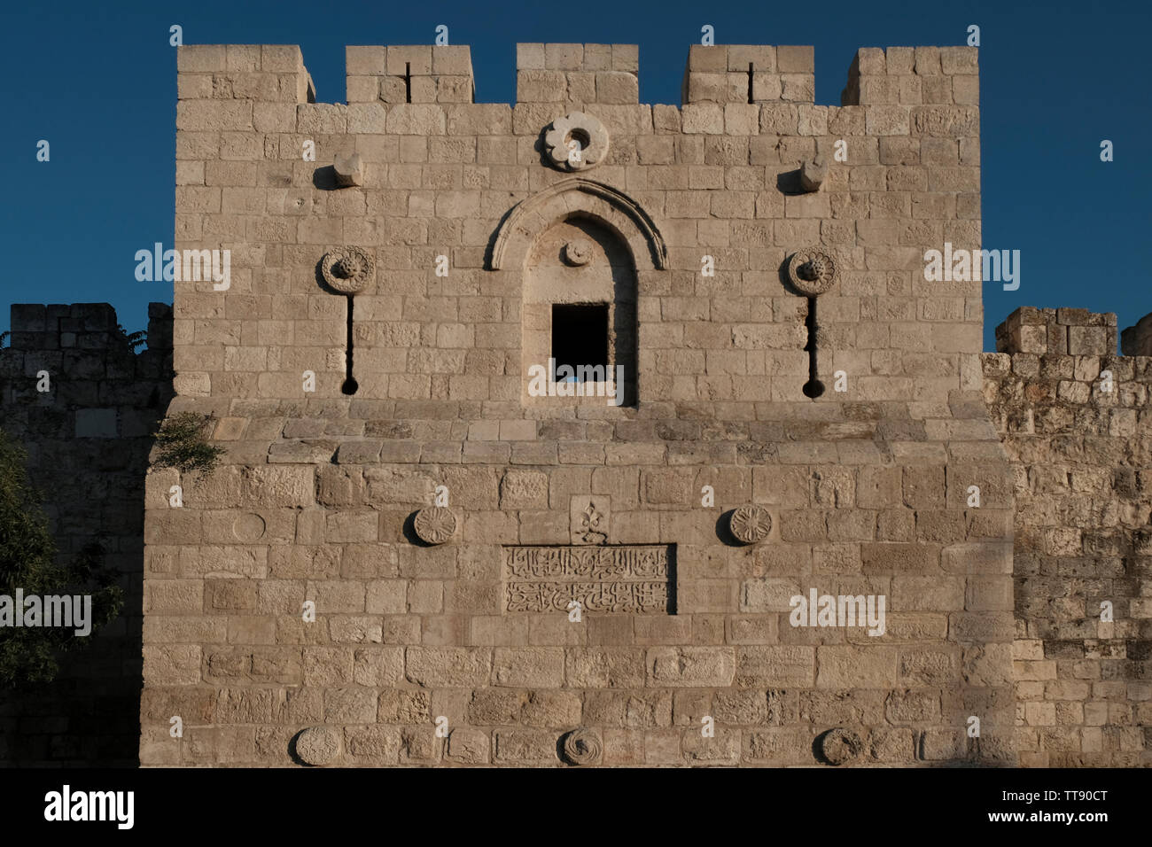 A battlement with arrow-slits at the northern Ottoman walls of the old city between Herod's Gate and Damascus Gate in East Jerusalem Israel Stock Photo
