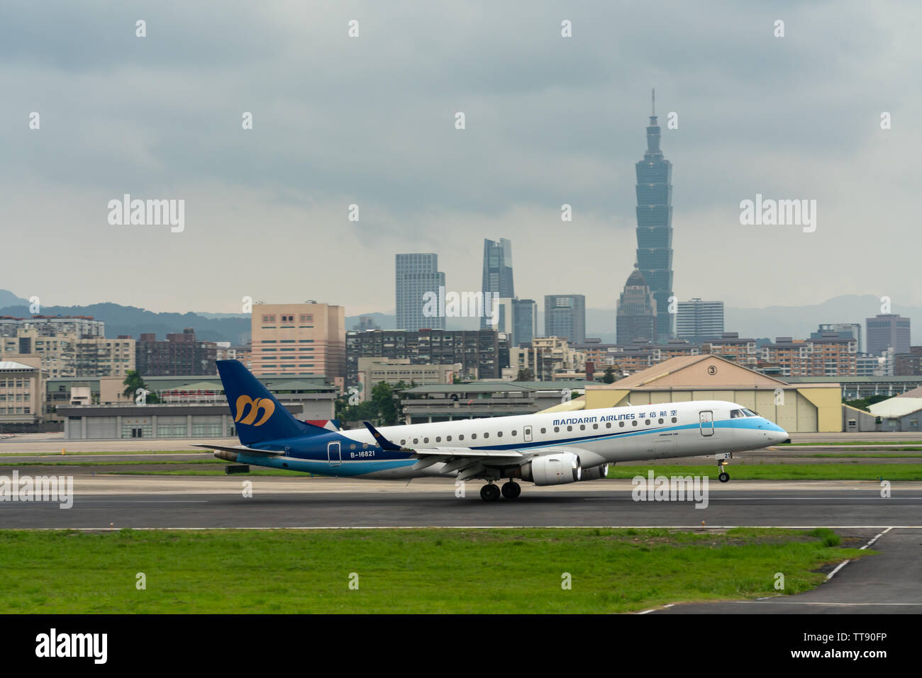 TAIPEI, TAIWAN - MAY 18, 2019: Mandarin Airlines Embraer ERJ-190-100 landing to the Taipei Songshan Airport in Taipei, Taiwan. Stock Photo