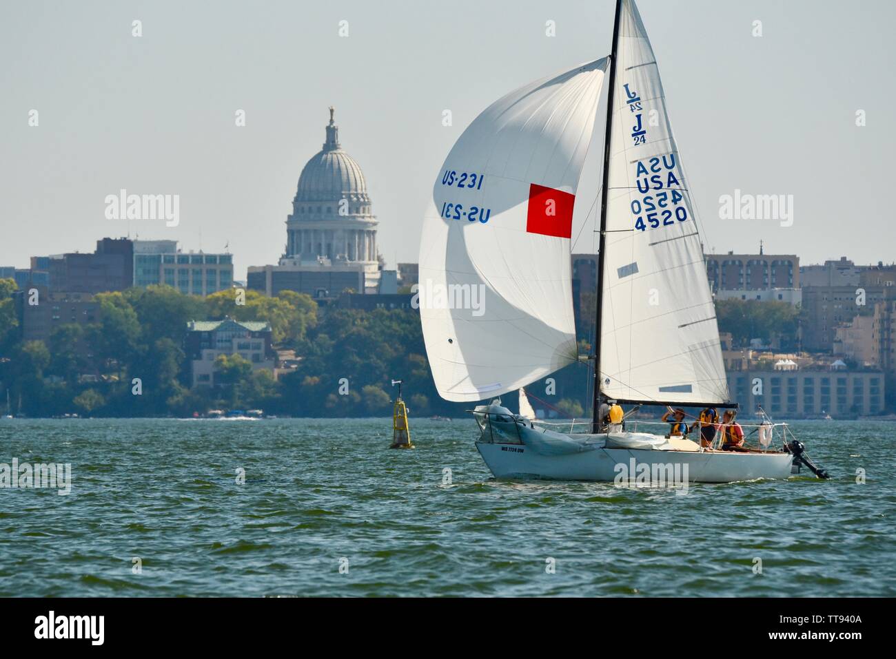 Sailing on Lake Mendota, with spinnaker up to catch the wind, with