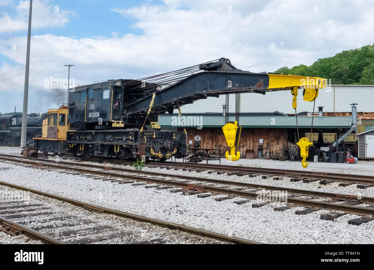 Restored railroad crane derrick car used for heavy lifting on and around railroads. Stock Photo