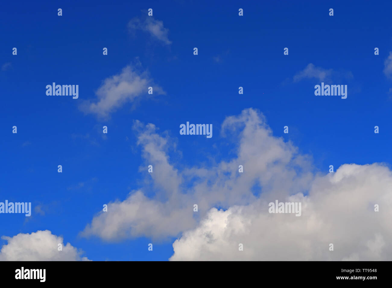 Shapes of clouds in blue sky Stock Photo - Alamy