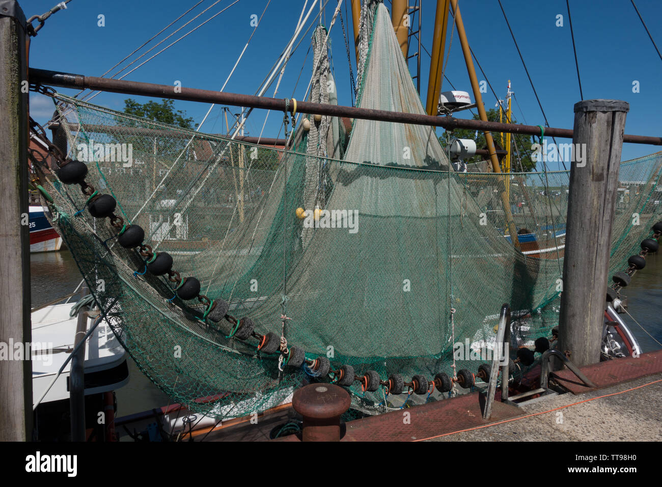 Fishing nets on trawler in harbour, Neuharlingersie, East Frisia, Lower Saxony, Germany Stock Photo