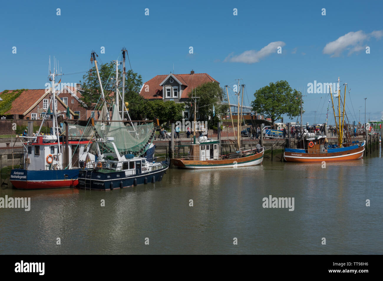 Fishing boats in harbour. Neuharlingersie, East Frisia, Lower Saxony, Germany Stock Photo