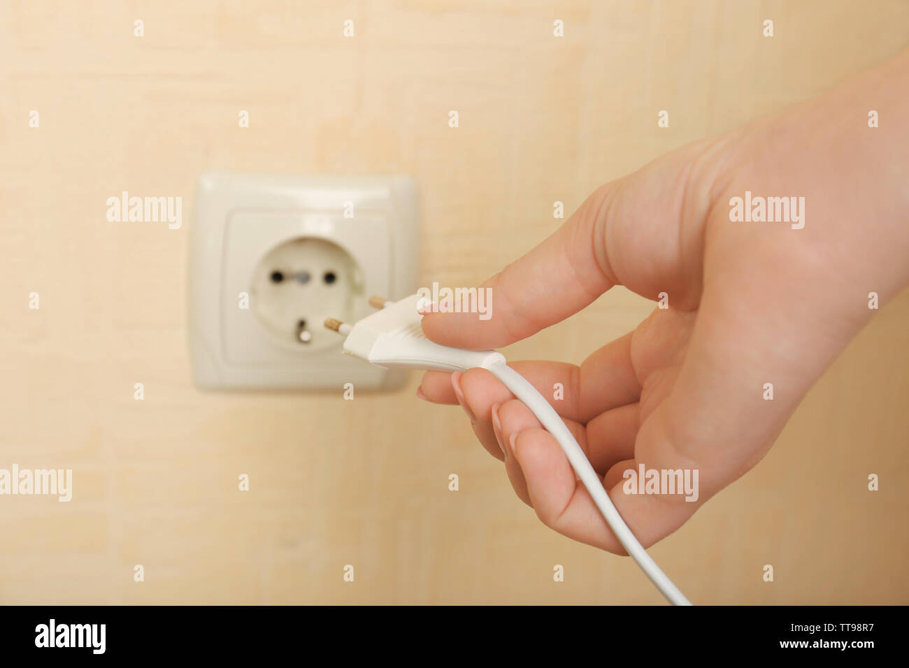 Putting plug. Белая розетка в руке. Plug into a socket. Unplug electrical supply. Put your plug in hole.