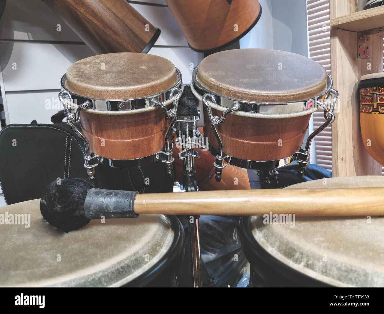 bongo drums percussion set at music store Stock Photo Alamy
