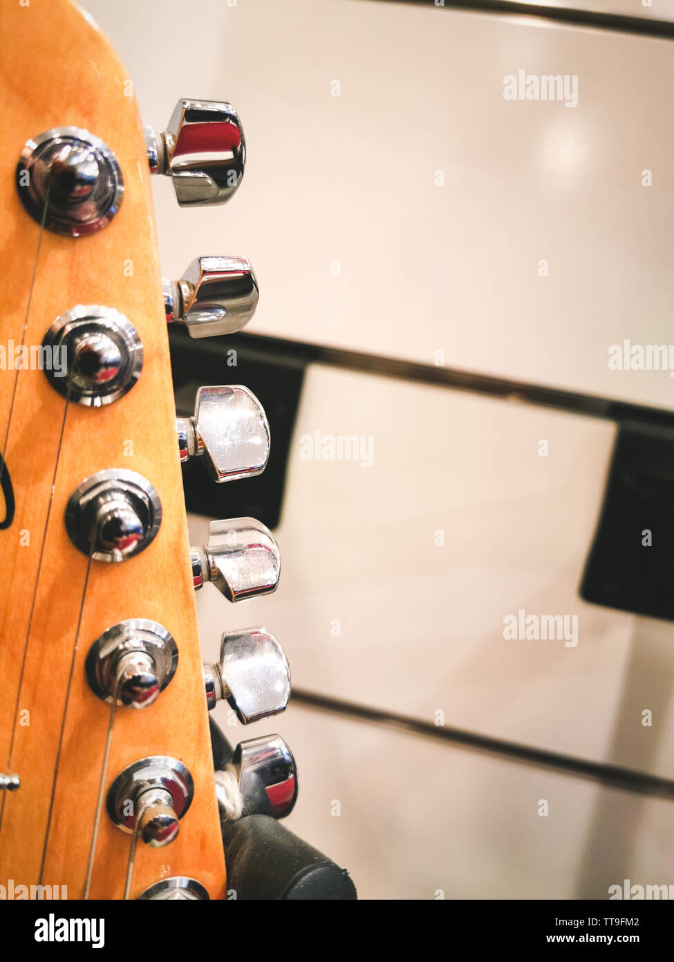 electric guitar headstock close up for tuning the strings Stock Photo