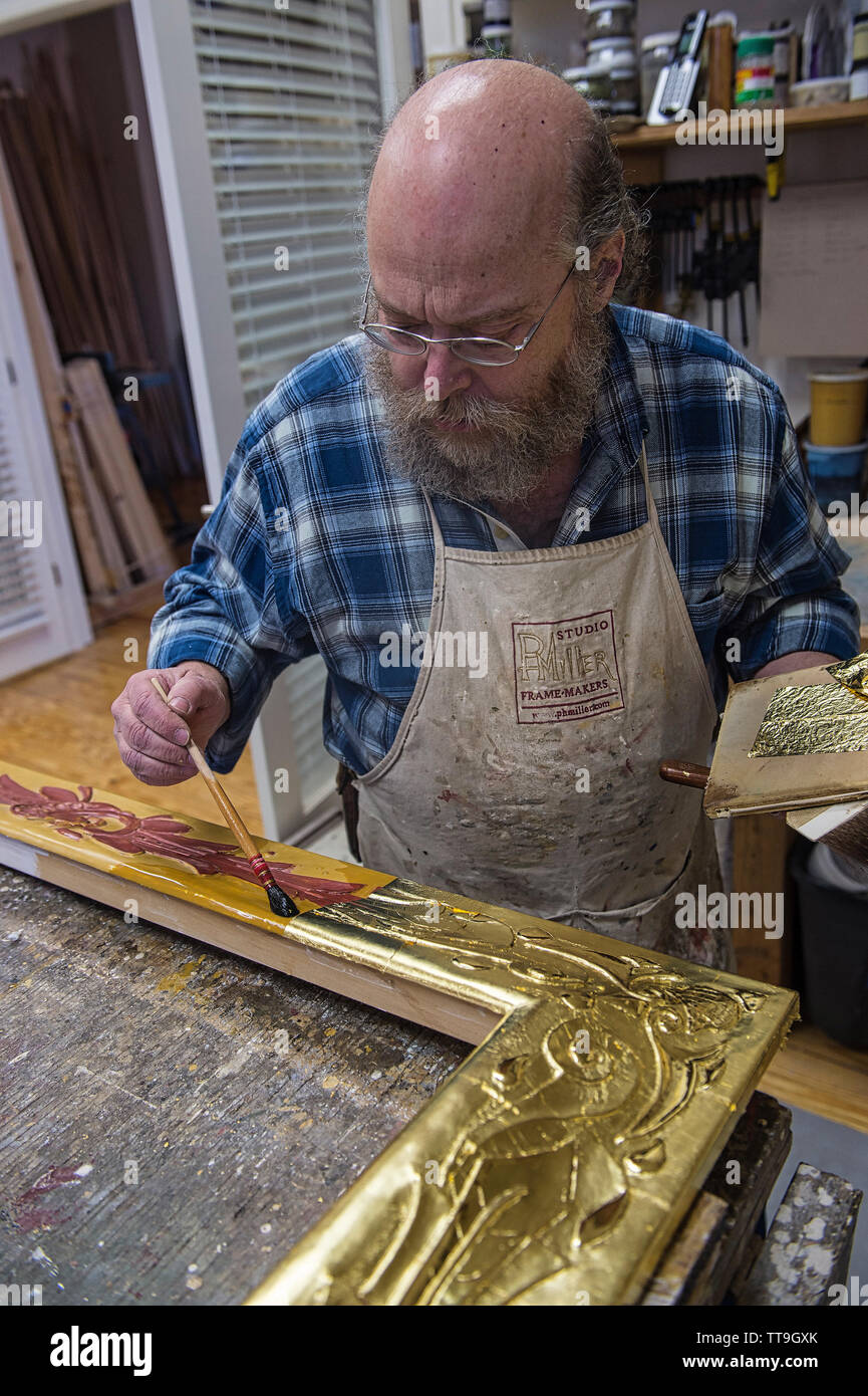 UNITED STATES - MARCH 02: Peter H. Miller, frame maker and owner of P.H. Miller Studio works in his studio in Berryville Virginia. Miller is widely kn Stock Photo