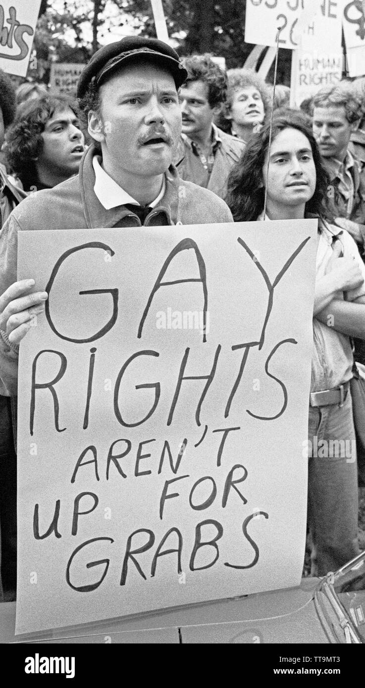 Demonstrator with 'Gay Rights aren't up for grabs' sign during Vice President Mondale visit to San Francisco, California.  June 17, 1977 Stock Photo