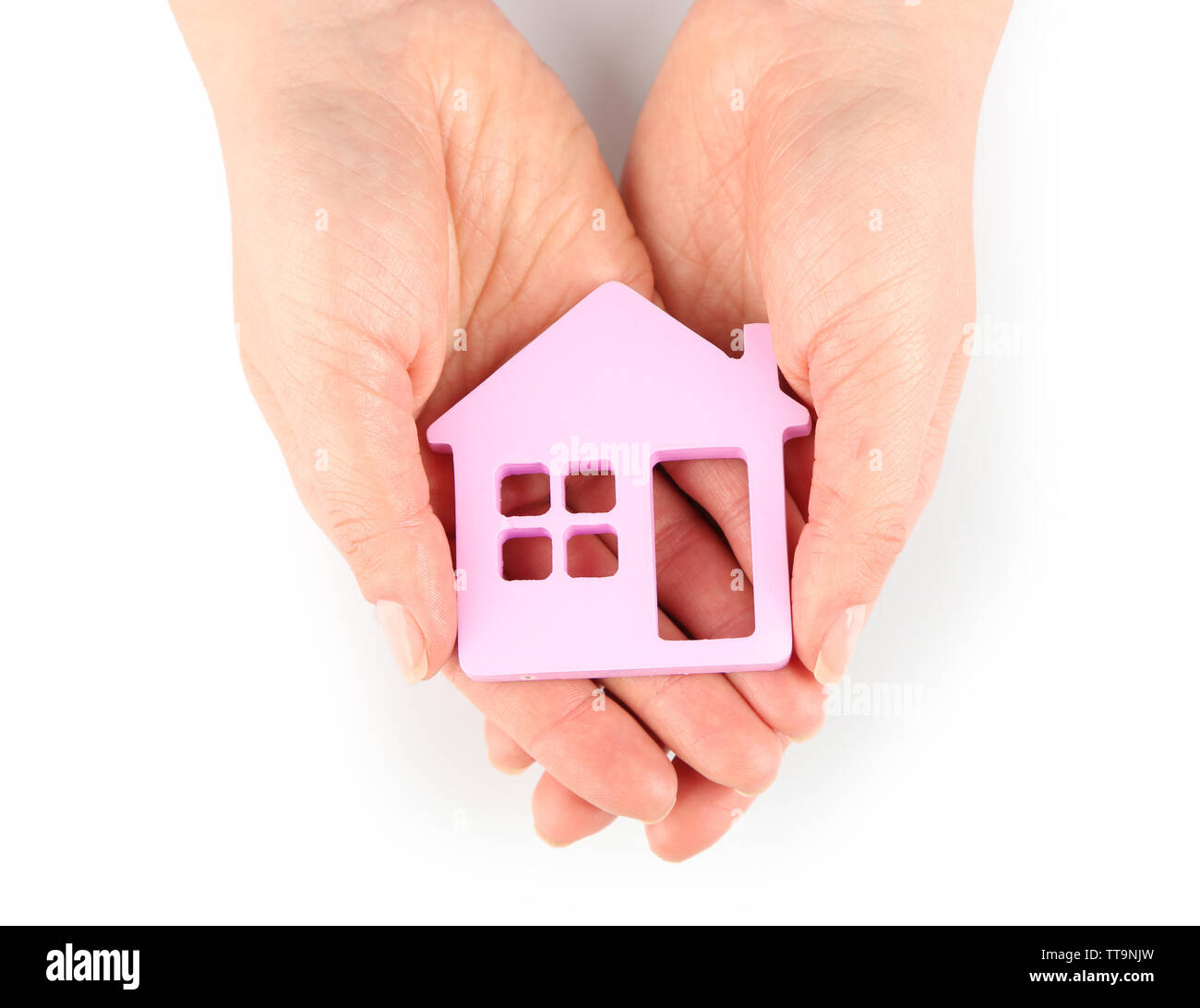 Female hands with model of house isolated on white Stock Photo - Alamy