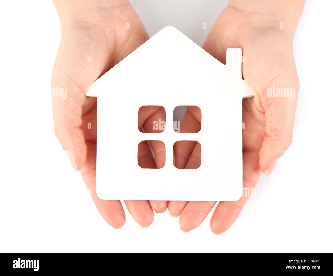Female hands with model of house isolated on white Stock Photo - Alamy