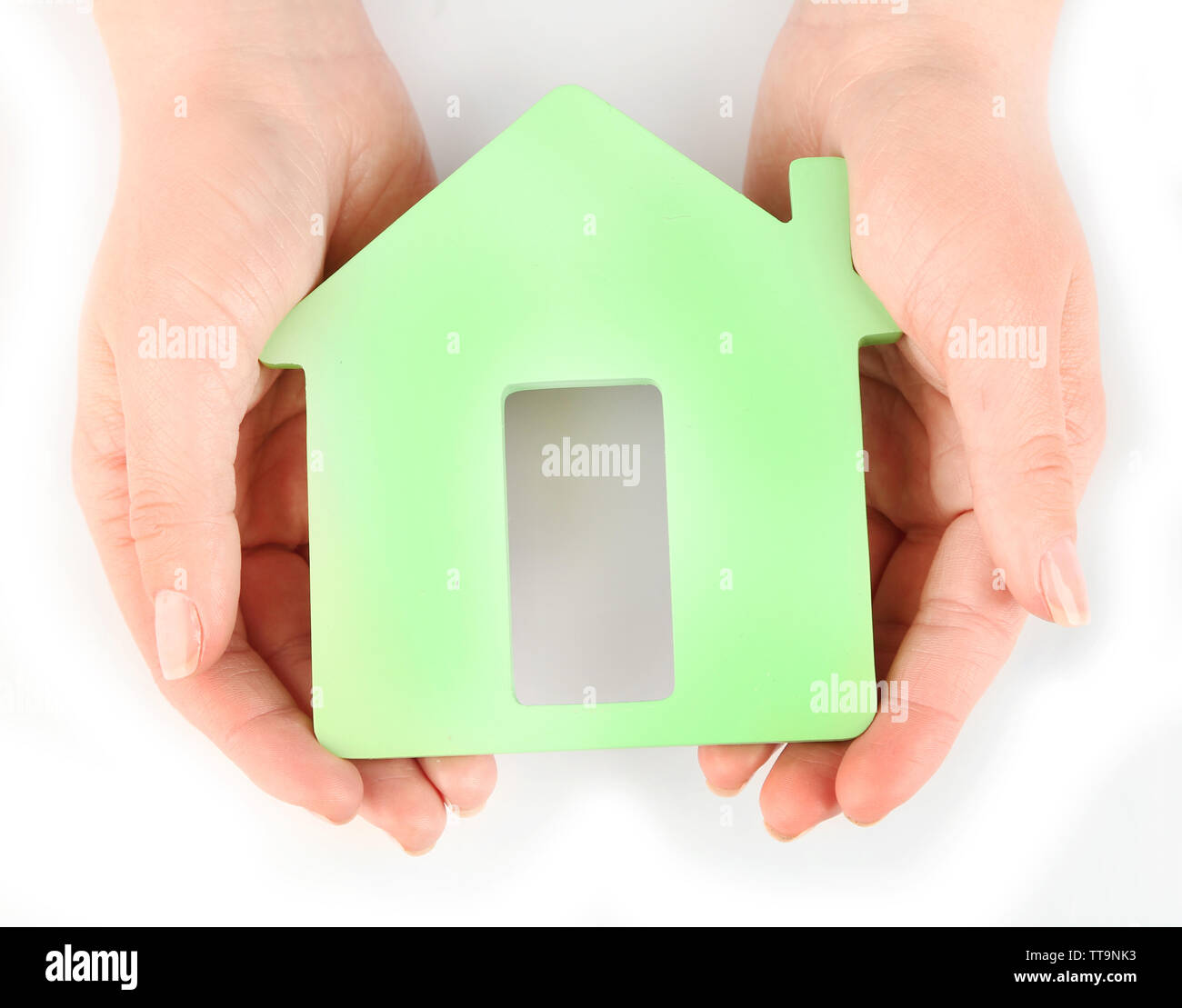 Female hands with model of house isolated on white Stock Photo - Alamy
