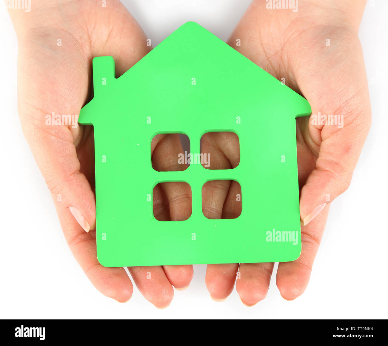 Female hands with model of house isolated on white Stock Photo - Alamy