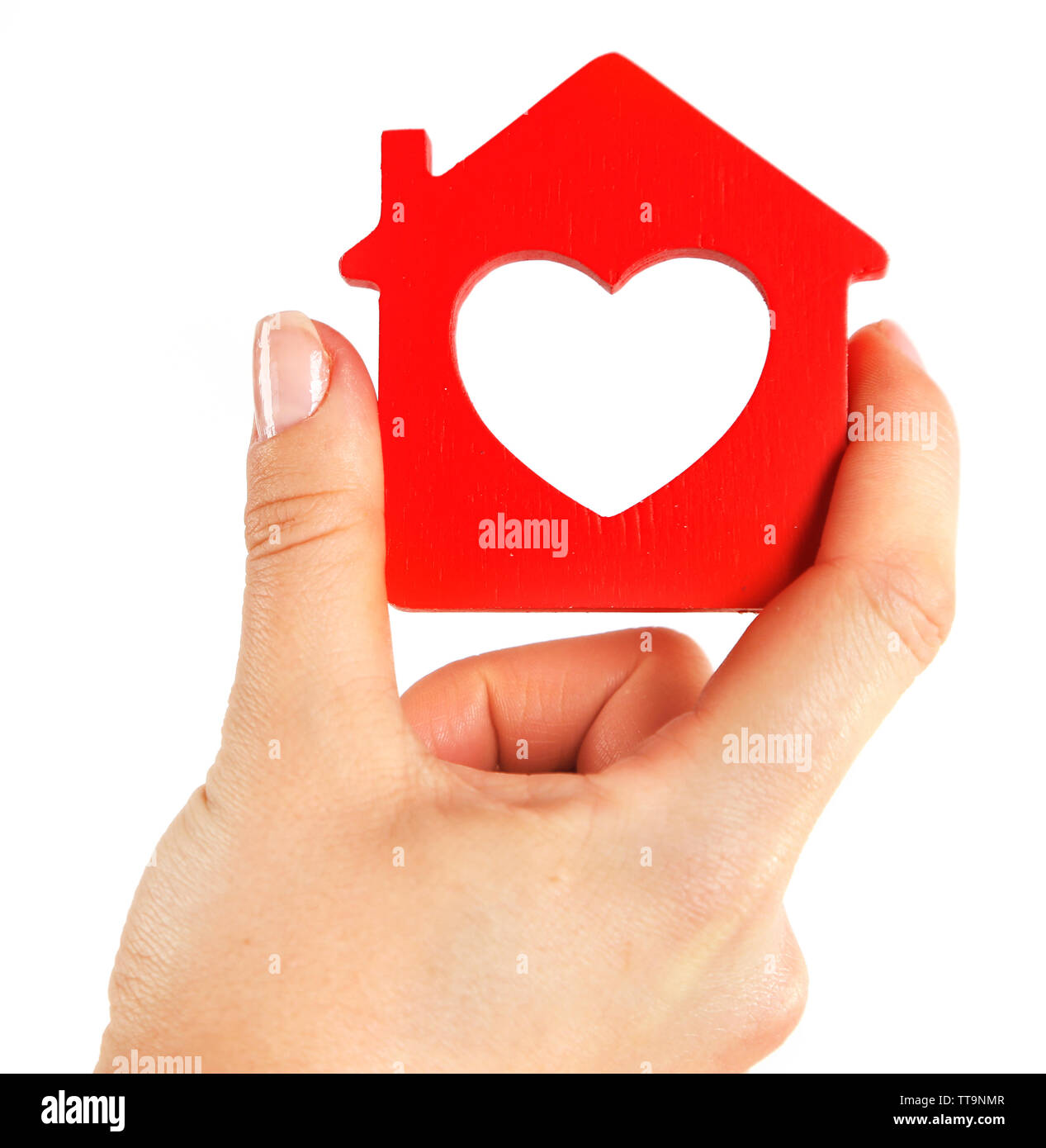 Female hand with model of house on blurred background Stock Photo - Alamy