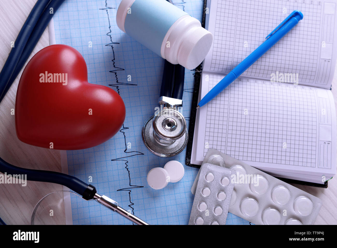 Cardiogram with stethoscope and red heart on table, closeup Stock Photo ...
