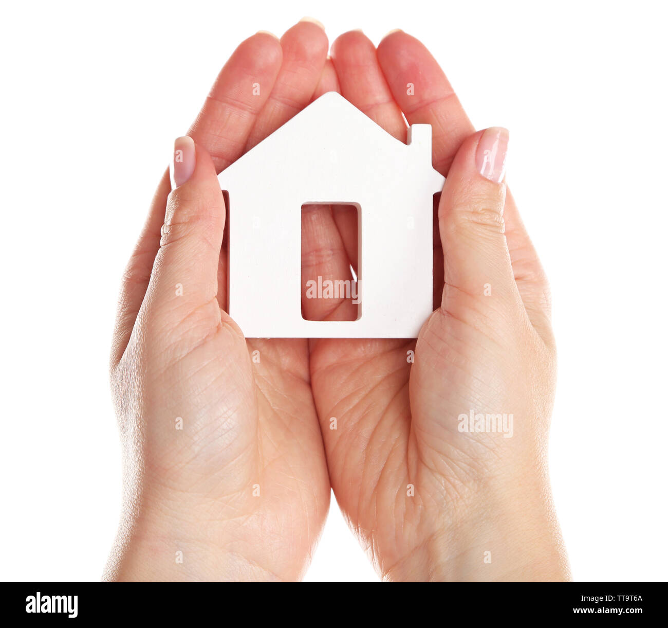 Female hands holding model of house isolated on white Stock Photo - Alamy