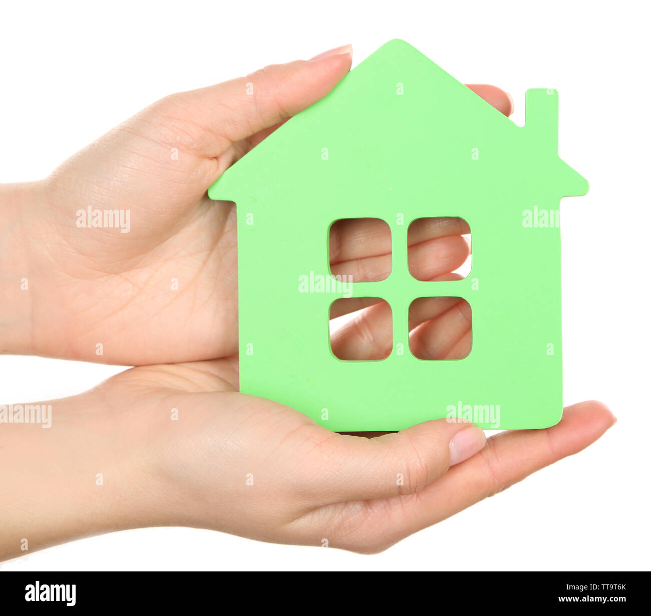 Female hands holding model of house isolated on white Stock Photo - Alamy