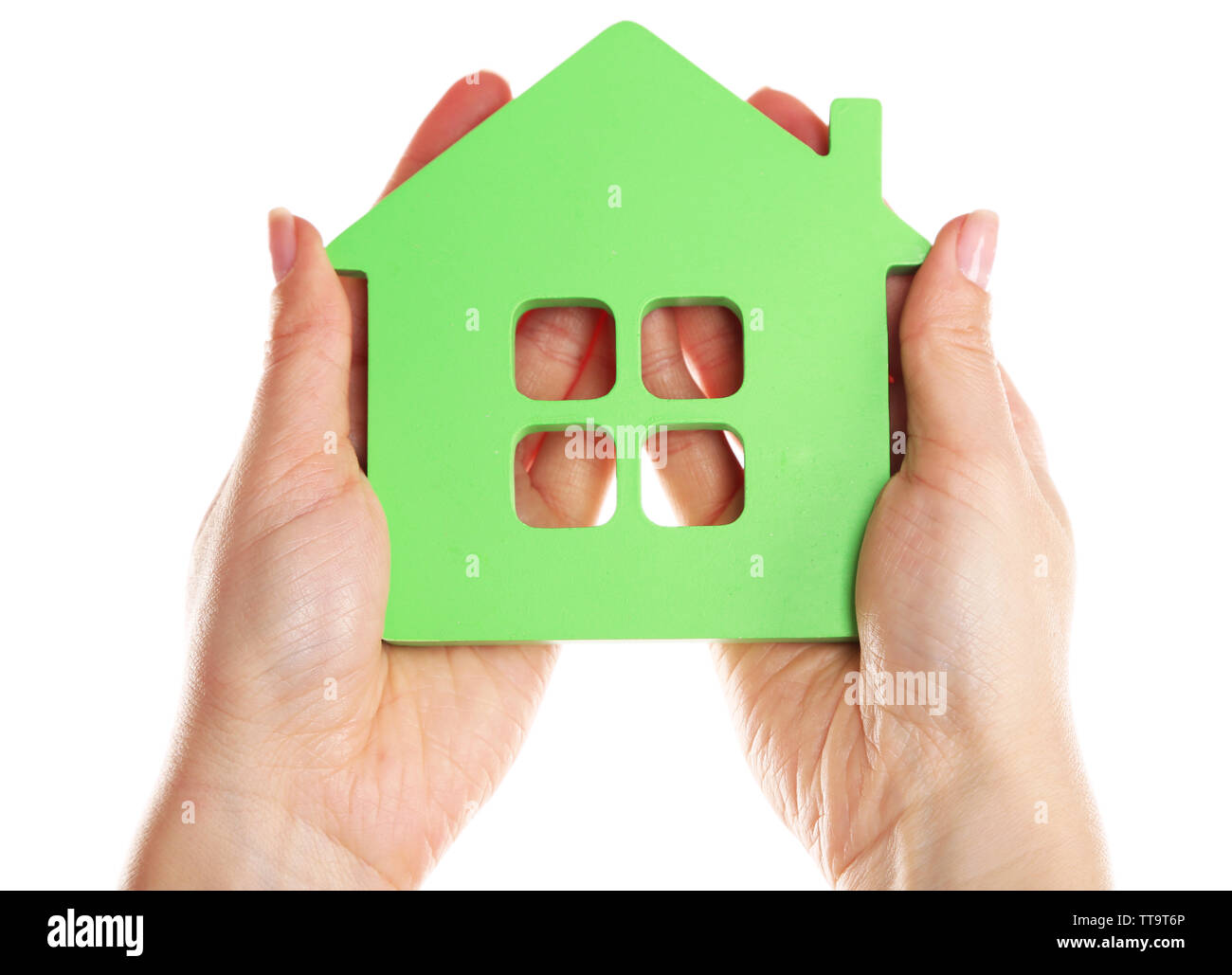 Female hands holding model of house isolated on white Stock Photo - Alamy