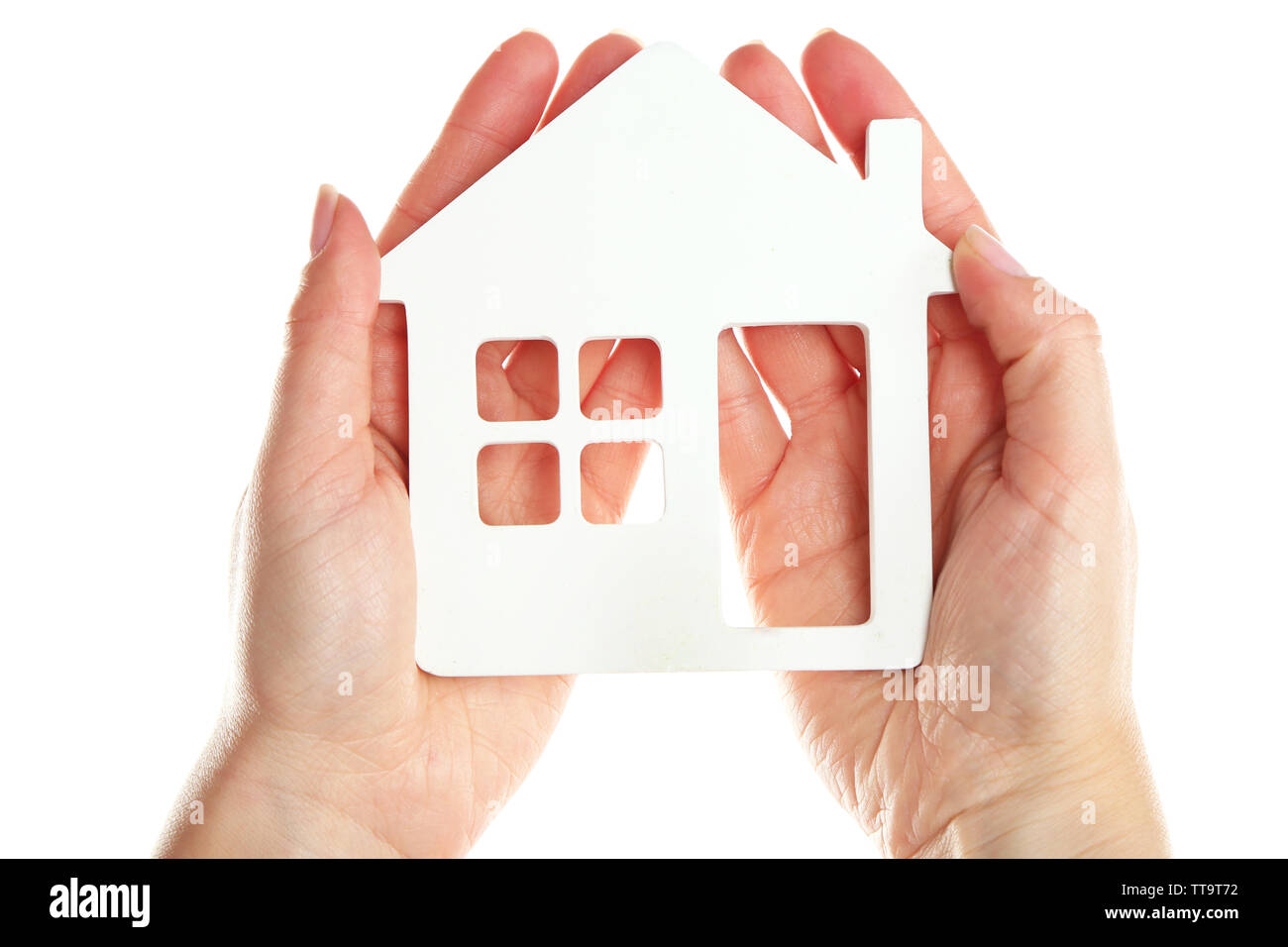 Female hands holding model of house isolated on white Stock Photo - Alamy