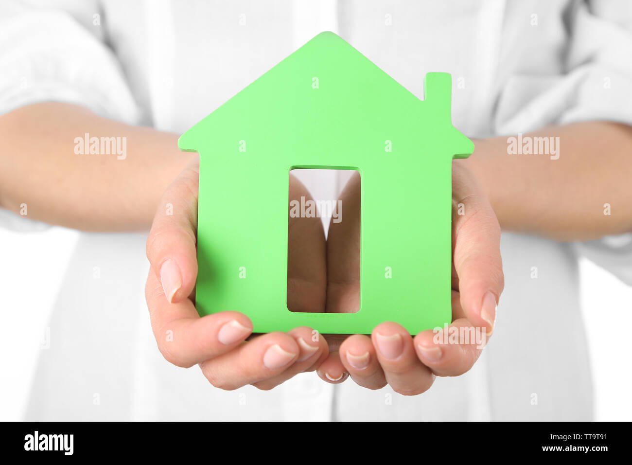 Woman holding model of house close up Stock Photo - Alamy