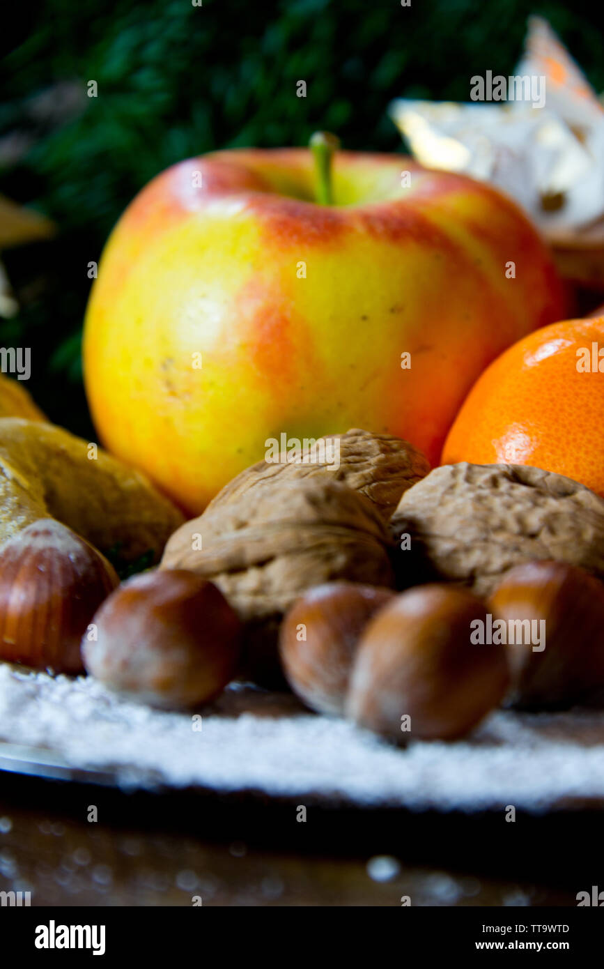 traditional german christmas sweets plate with fruits, nuts aqnd