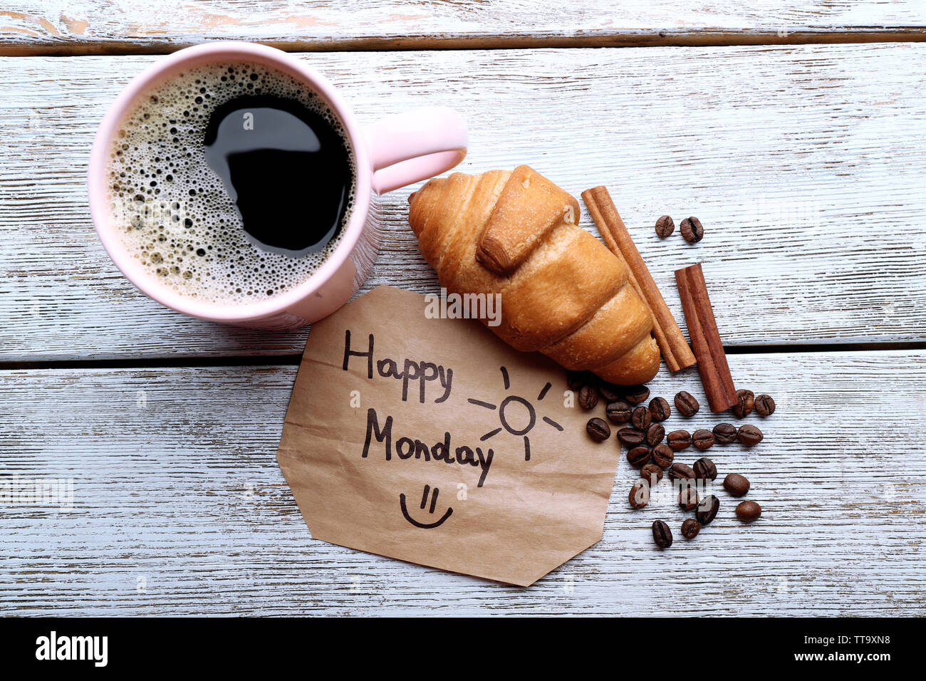 Cup of coffee with fresh croissant and Happy Monday massage on ...