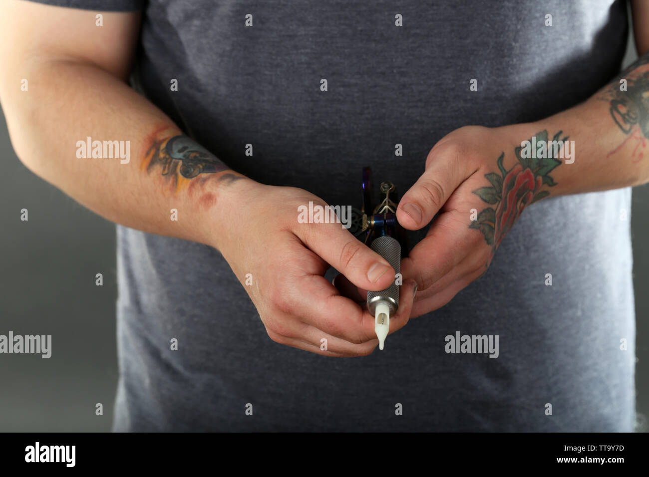 Hands tattoo artist hold hi-res stock photography and images - Alamy