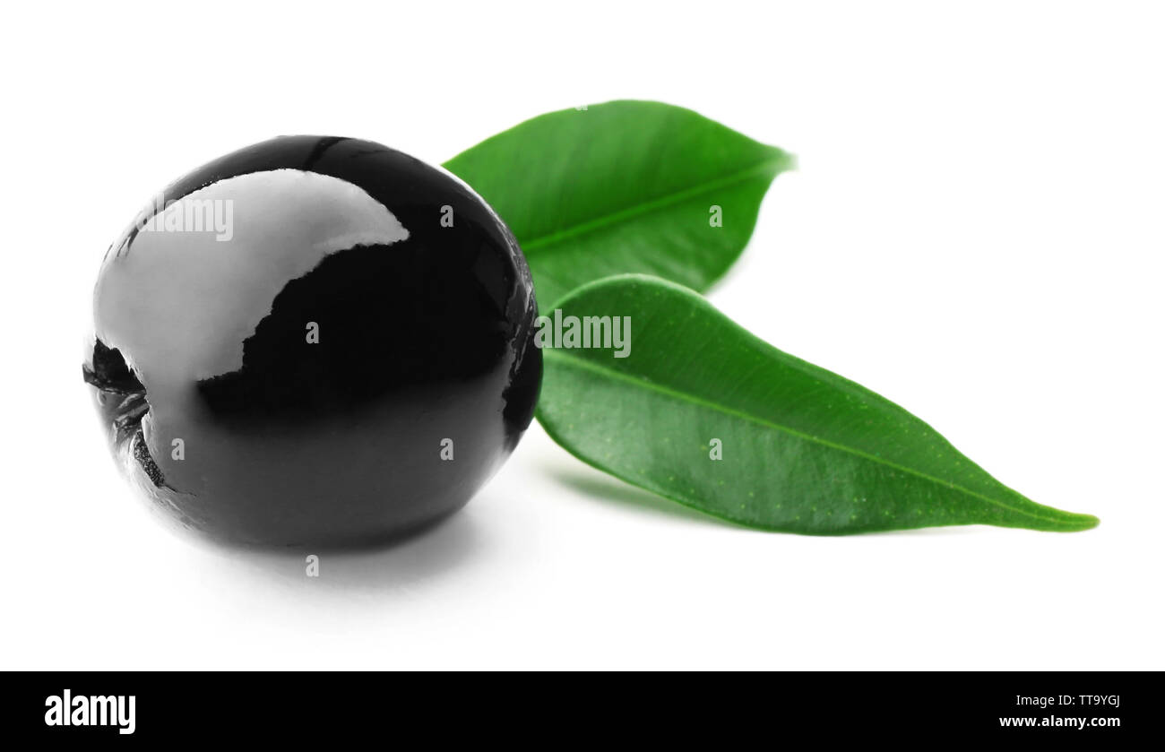 Black olive with green leaves isolated on white Stock Photo - Alamy