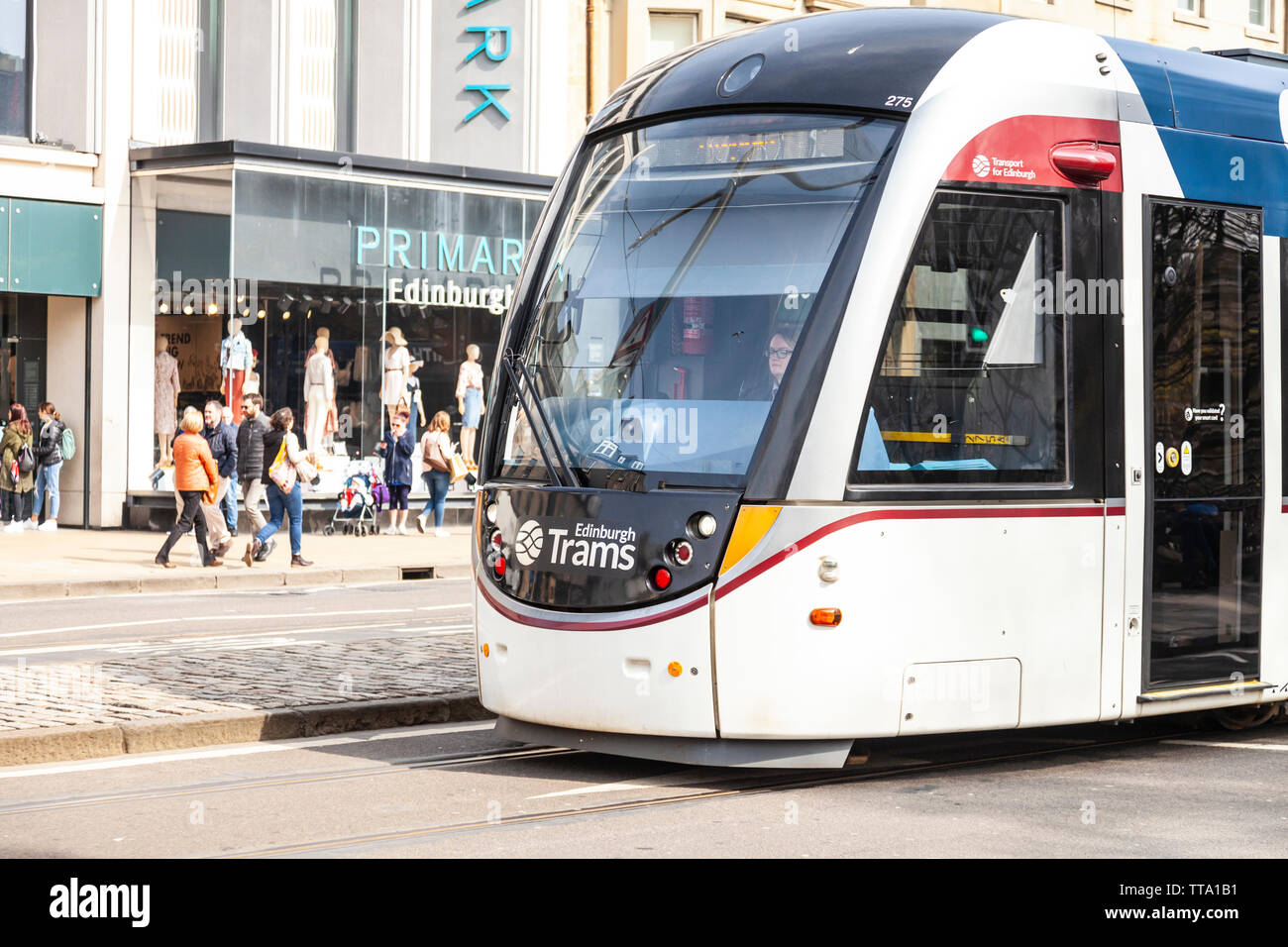 An Urbos 3 tram in Princes Street  in Edinburgh, Scotland, UK. The city's tramway / light rail service opened in 2013. Stock Photo