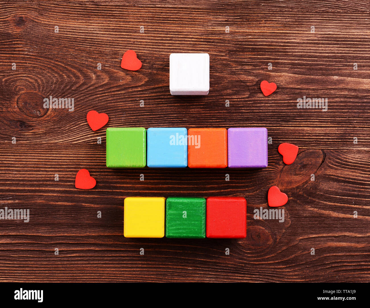 Colorful cubes for inscriptions on wooden background Stock Photo - Alamy