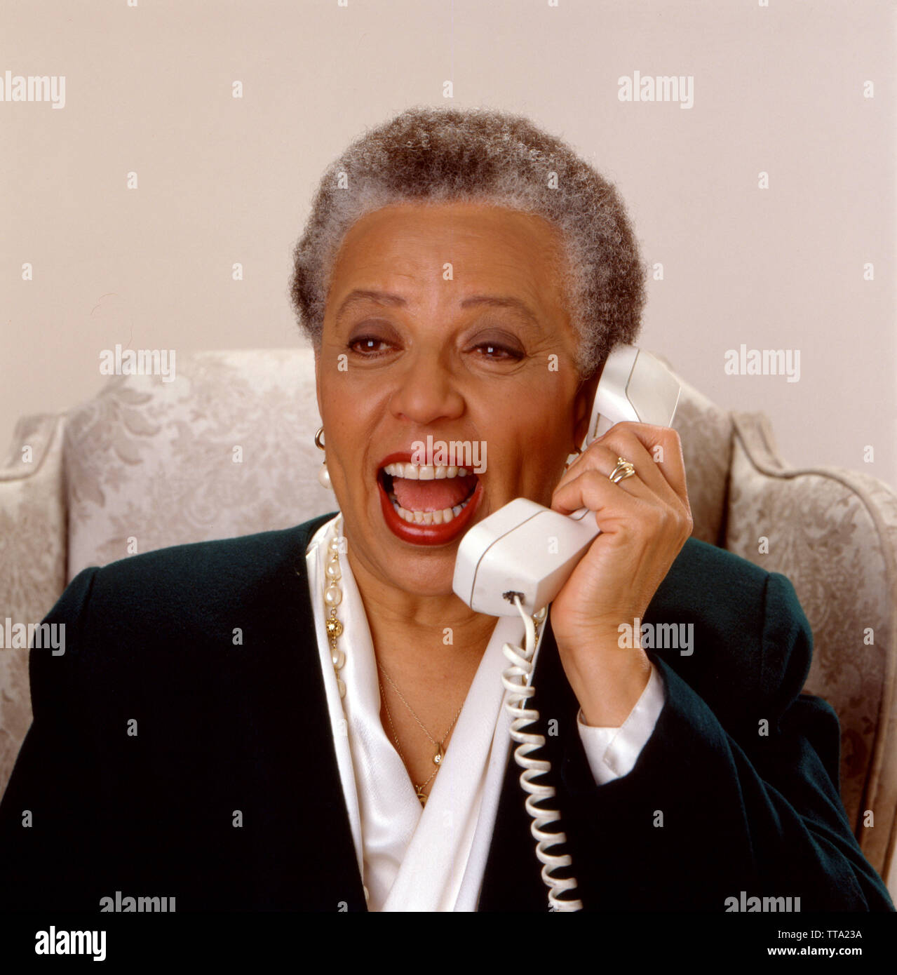 African American grandmother on phone Stock Photo