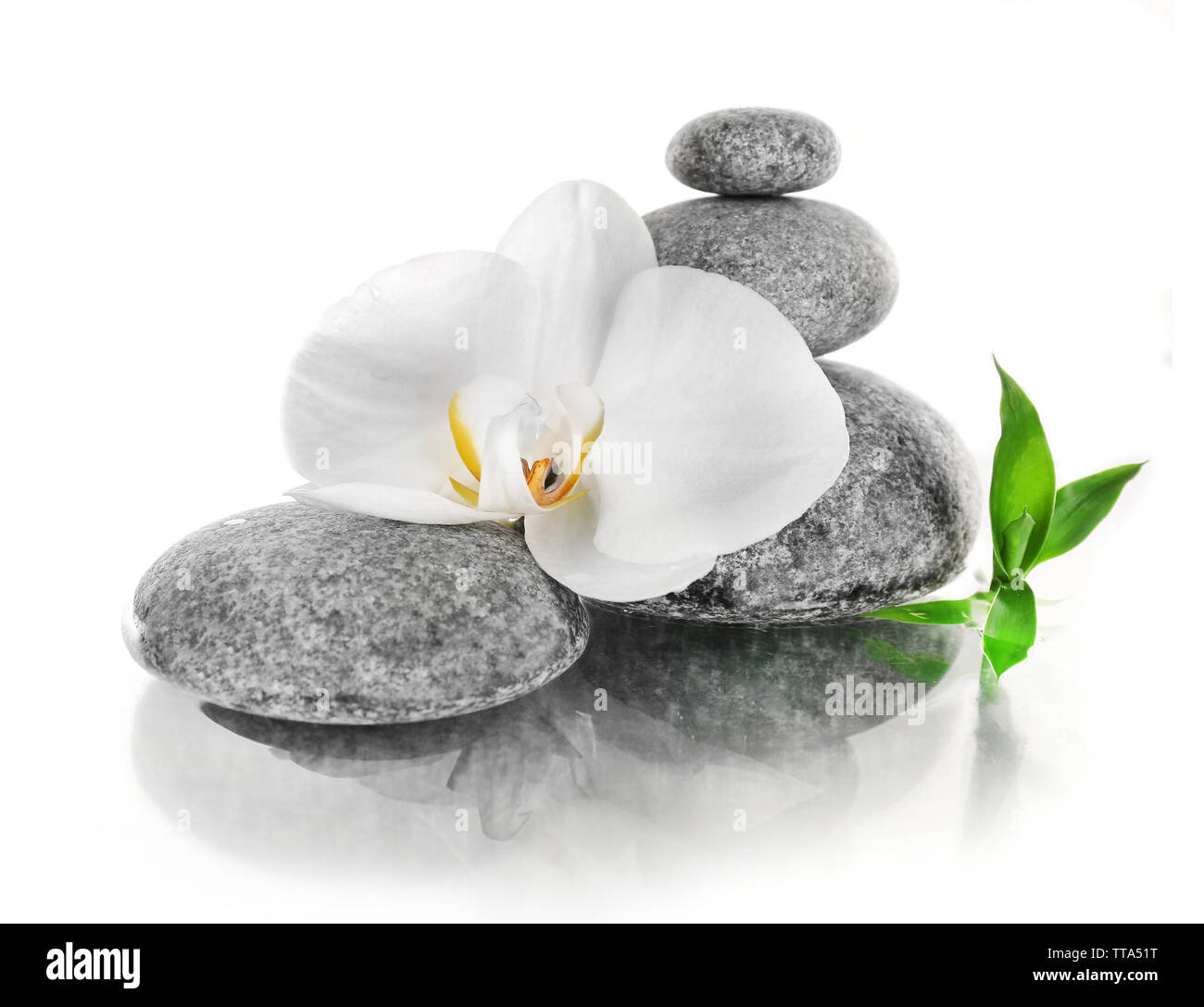Stack of spa stones with orchid flower isolated on white Stock Photo ...