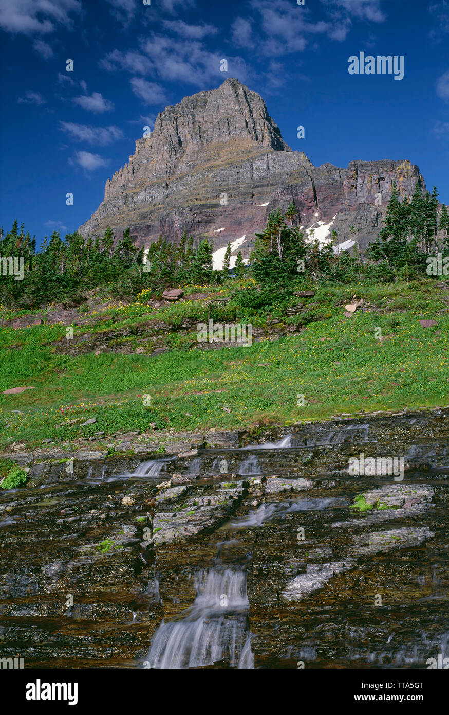 USA, Montana, Glacier National Park, Small waterfall on Logan Creek descends sedimentary layers beneath Clements Mountain. Stock Photo