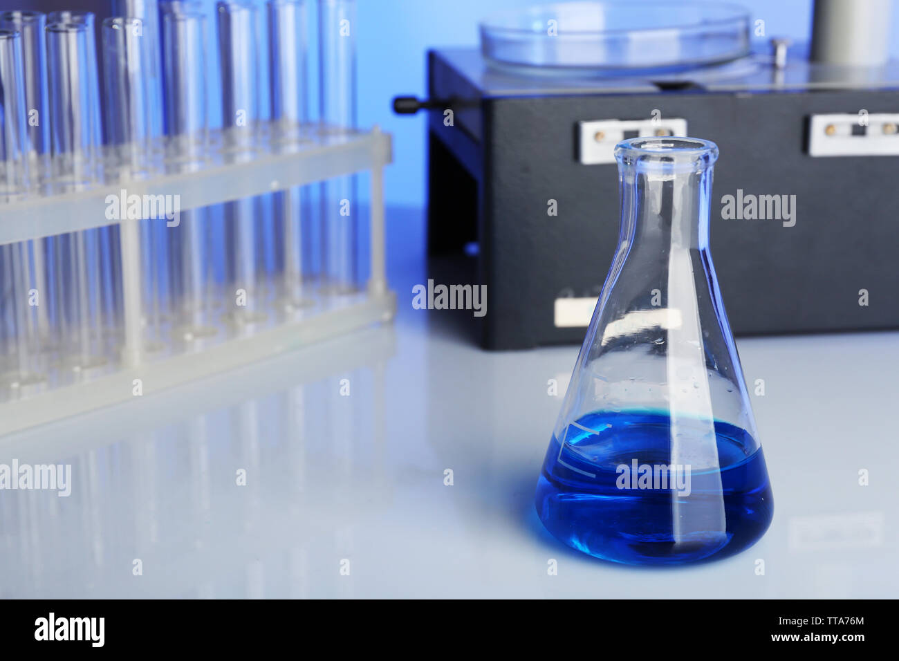 Test tubes and microscope in laboratory Stock Photo - Alamy
