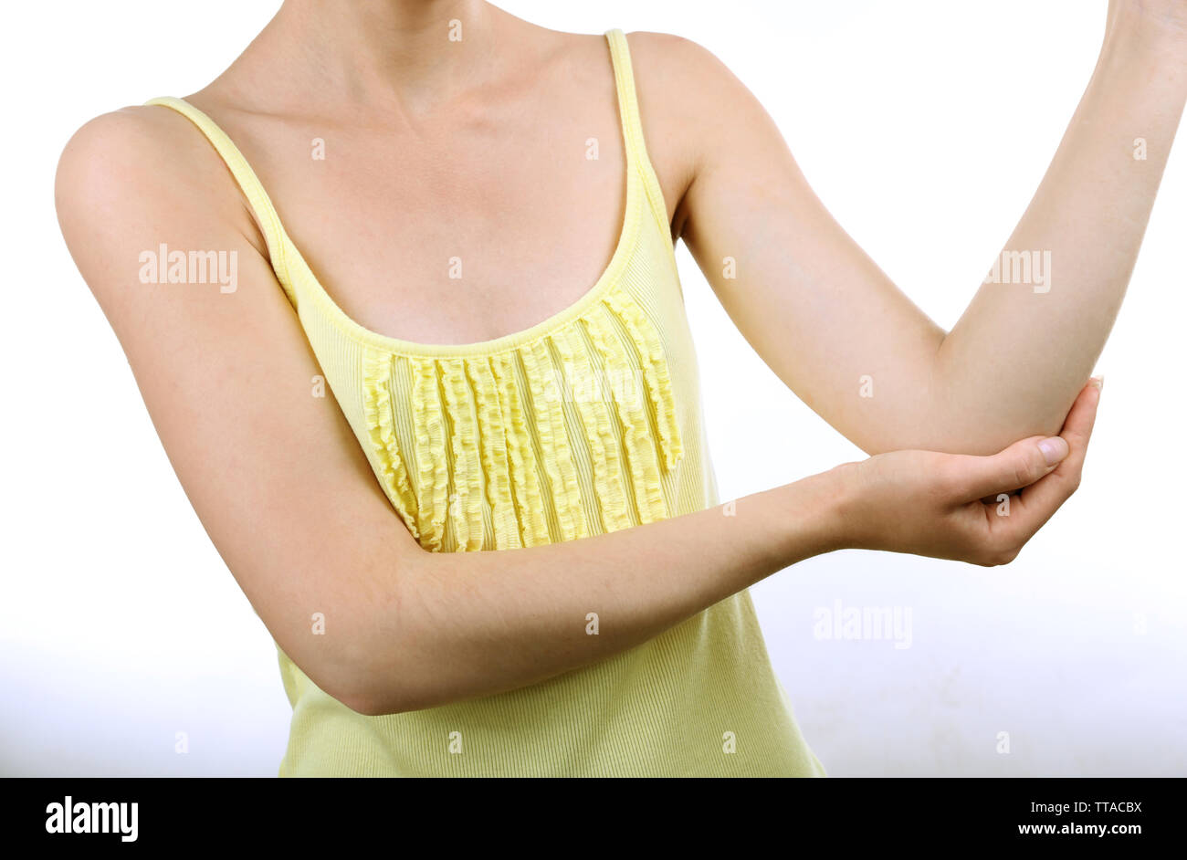 Young woman with elbow pain isolated on white Stock Photo Alamy