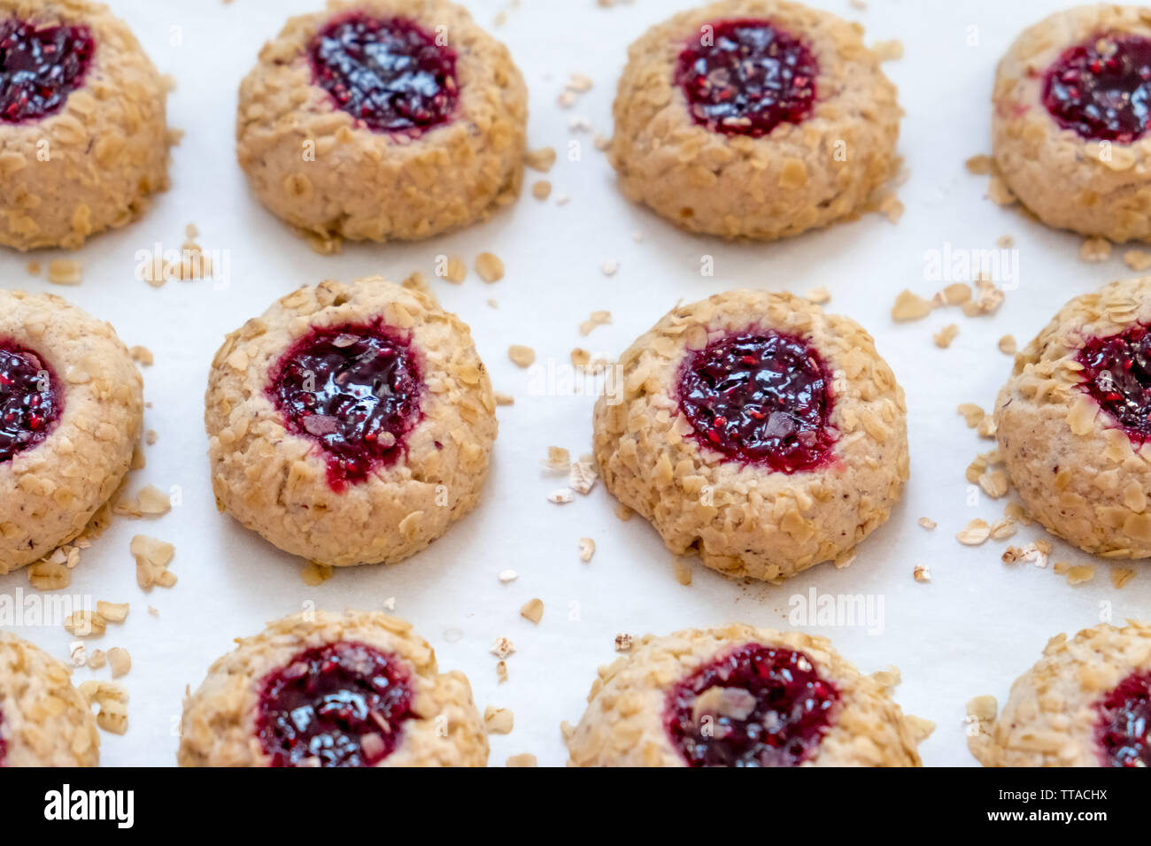 Side View of Raspberry Jam Oatmeal Thumbprint Cookies Sitting on a