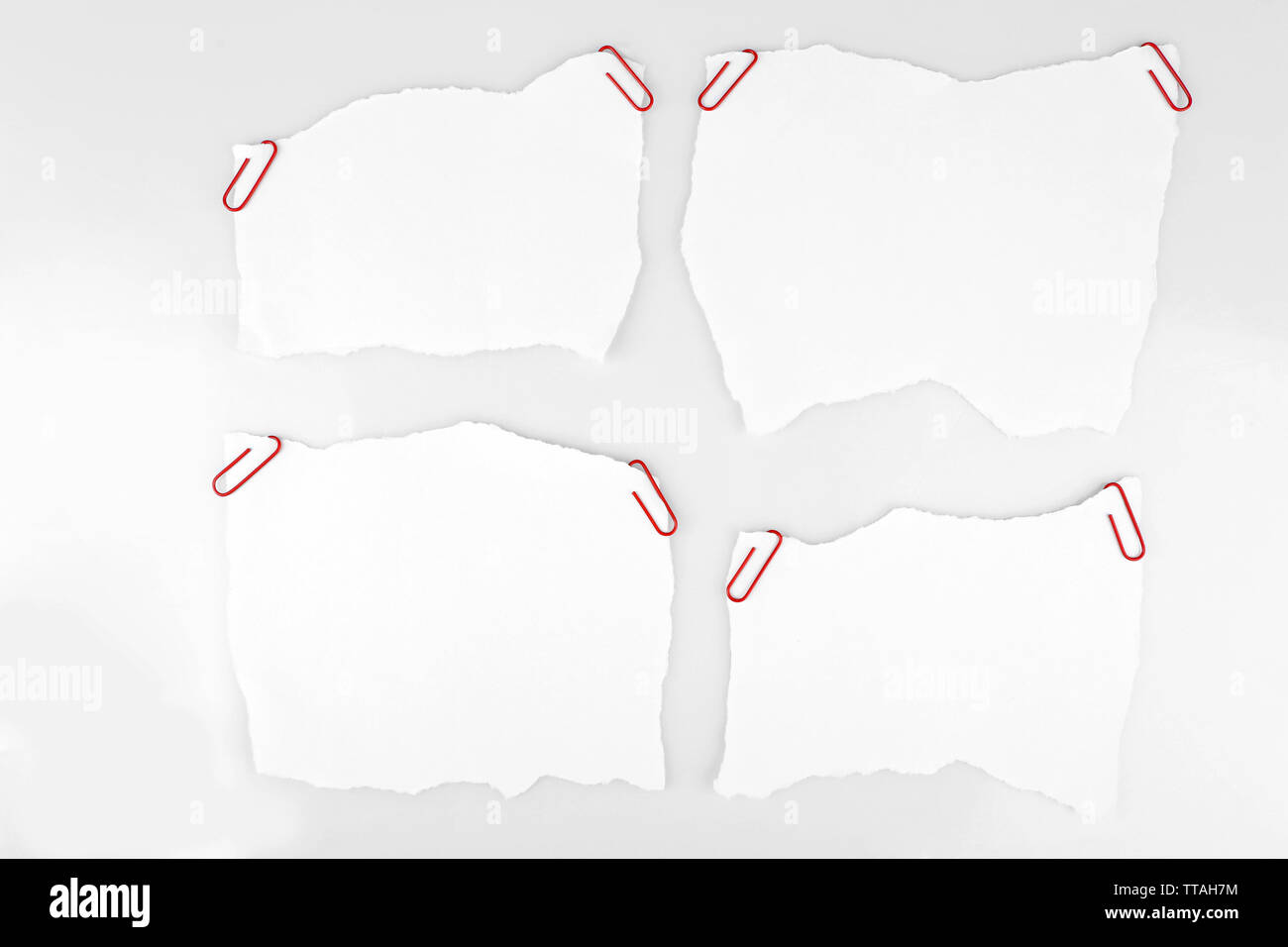 White pieces of paper attached on white background Stock Photo - Alamy