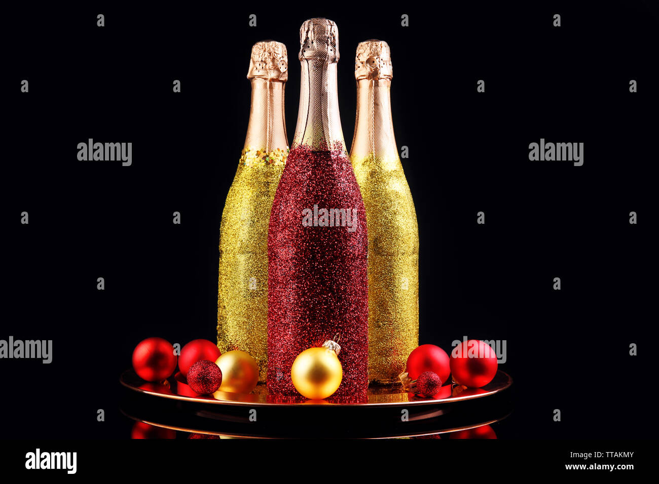 Decorative champagne bottles on dark background Stock Photo - Alamy