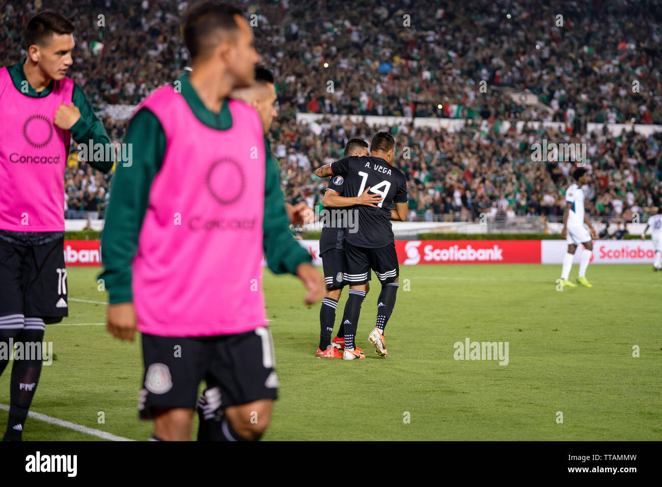 Pasadena, USA. 15th June, 2019. Alexis Vega (14) celebrates after scoring Mexico's sixth goal of the game in their Gold Cup opener against Cuba. Credit: Ben Nichols/Alamy Live News Stock Photo
