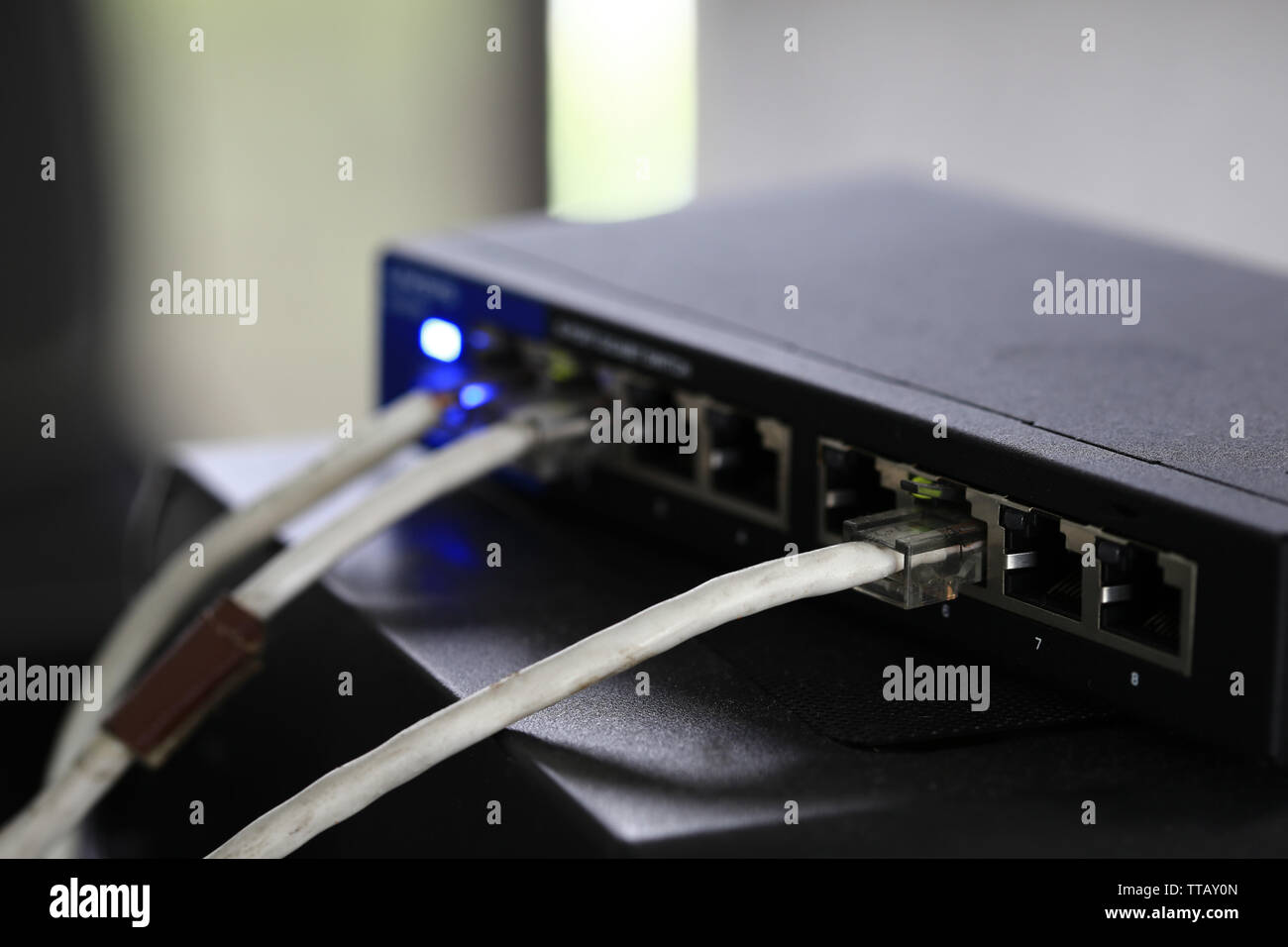 fiber optic Internet, Modem router network hub . cable connected router. internet connection, data, speed test concept. ethernet cables plugged close Stock - Alamy