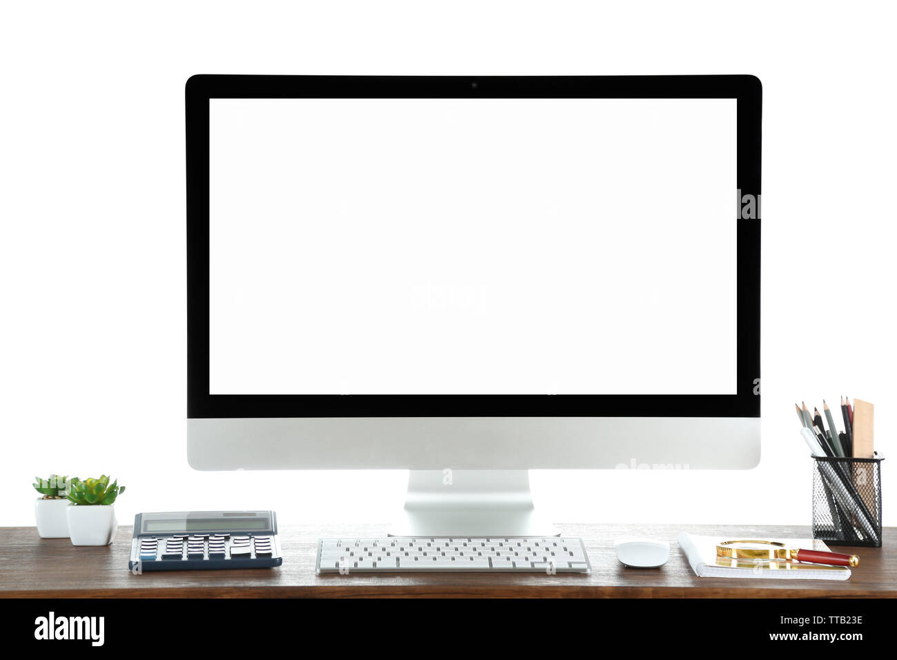 Computer on wooden table with blank white background Stock Photo - Alamy