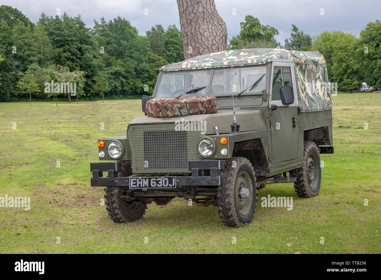 1970 70s Green army 88 Land rover, military restored vehicles at Leyland Festival, UK. The Army Land Rover series I, II, and III are off-road vehicles produced by the British manufacturer. Station Wagon camouflage military Land Rovers, were made available in both 88-inch (2,200 mm) and 109-inch (2,800 mm) types. Stock Photo